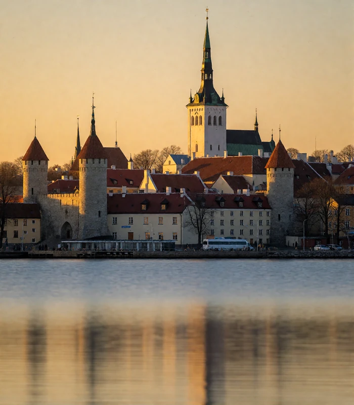 Tallinn skyline in Estonia seen from calm harbour water at dusk